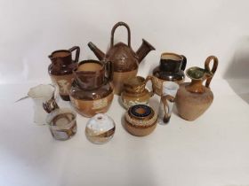 A selection of Royal Doulton and Lambeth stoneware jugs to include an Egyptian style jug, 'The Old