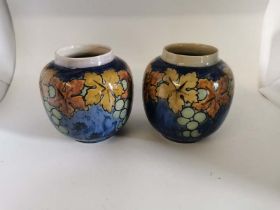 A Pair Of Royal Doulton Arts & Crafts Grape Motif Vases, Signed Bessie Newberry C1920s. Each 15cm