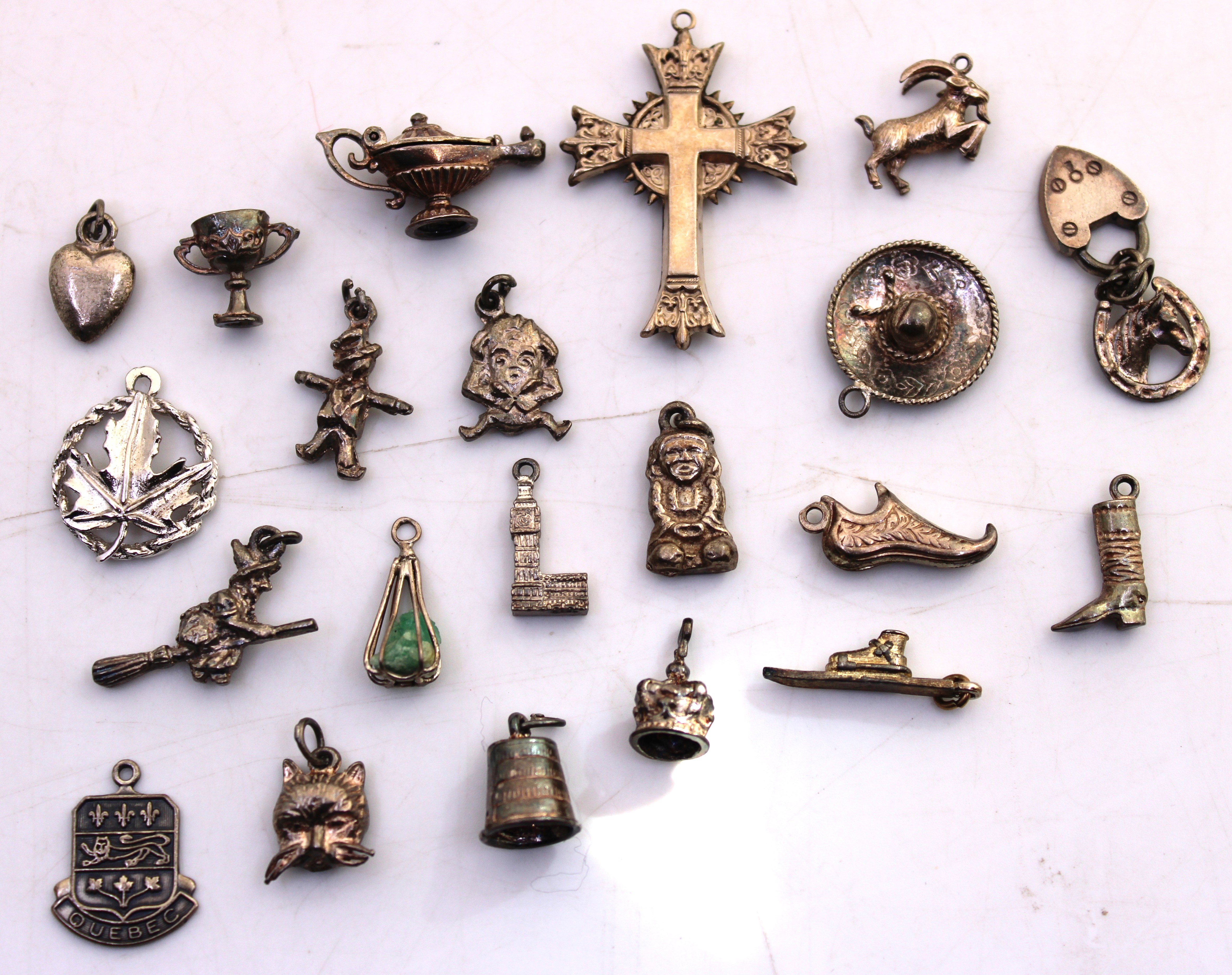 Selection of Sterling Silver and Unmarked White Metal Charms. To include a Genie Lamp, Witch on a
