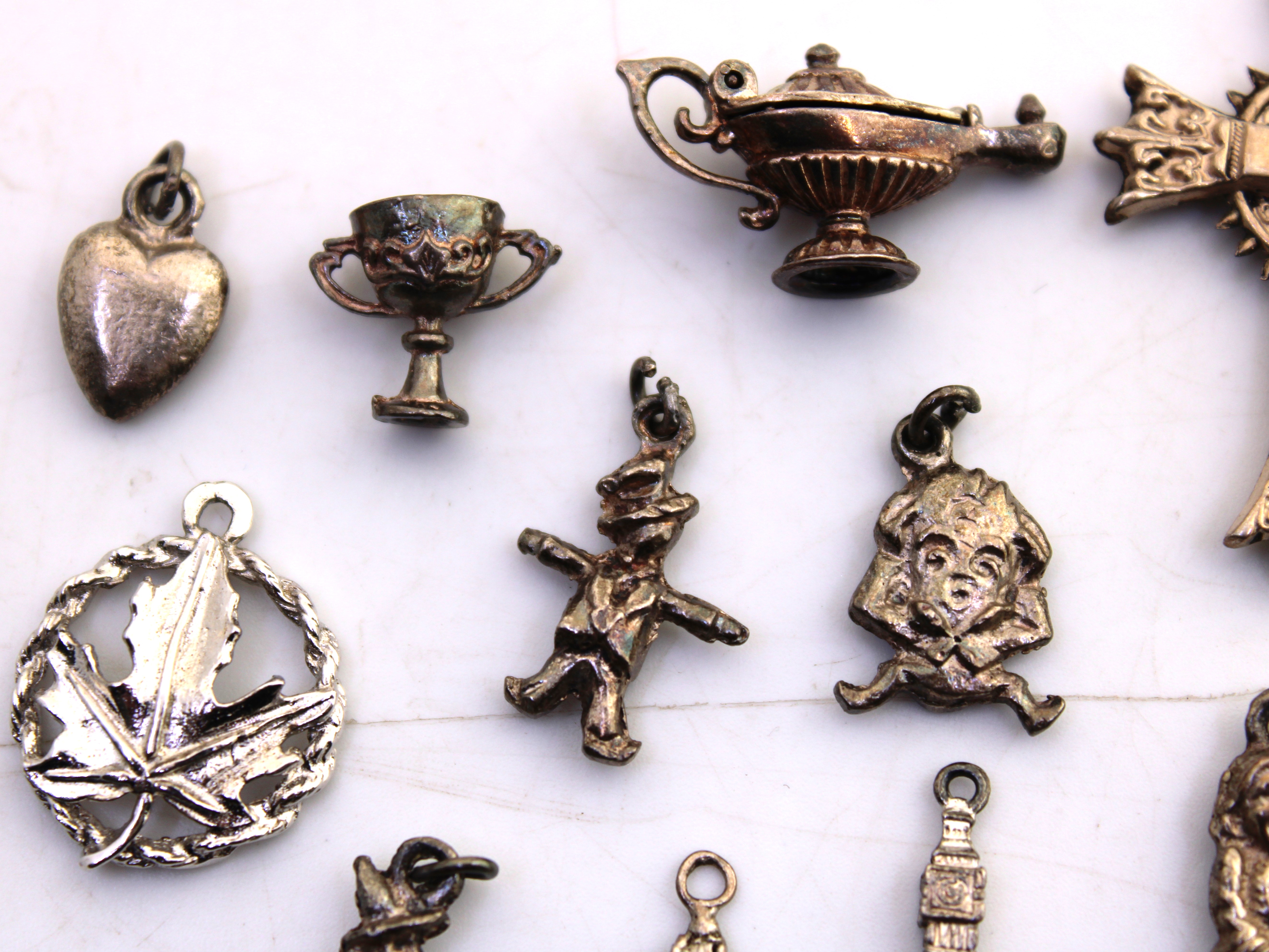 Selection of Sterling Silver and Unmarked White Metal Charms. To include a Genie Lamp, Witch on a - Image 2 of 5