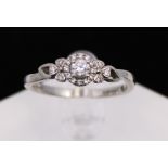 Emmy London Palladium 0.33ct Solitaire Diamond Ring with Surrounding Diamonds Halo Design.  There is