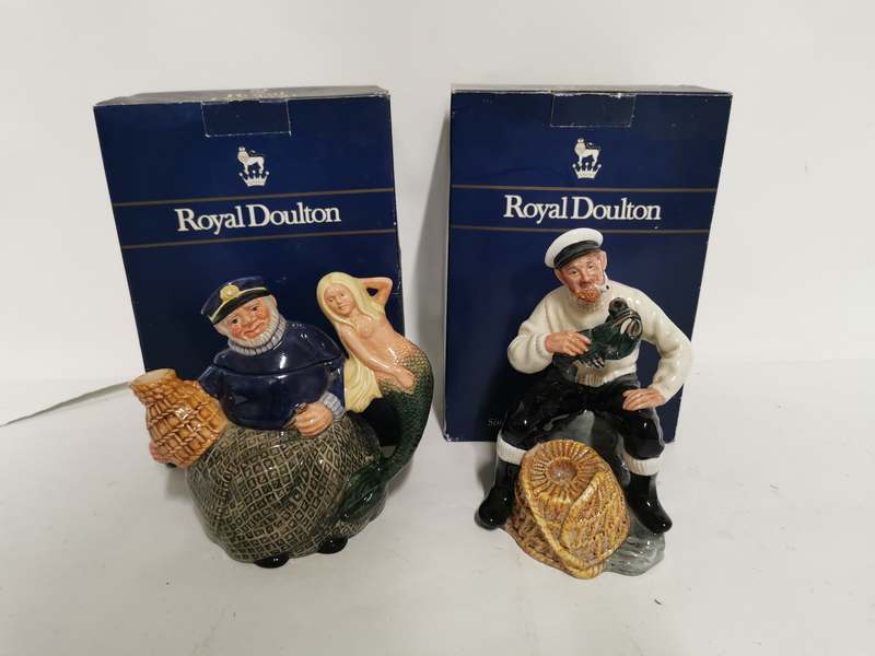 A Royal Doulton teapot 'Old Salt' and a Royal Doulton figurine 'Lobster Man'. (2)