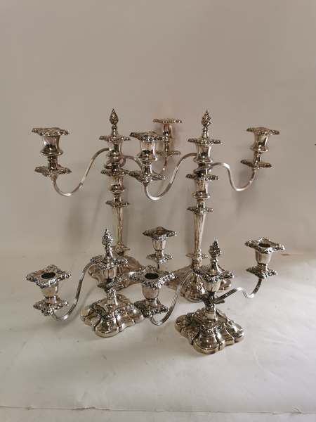 A pair of two branch Sheffield plated candelabra, approximately 14'' high. Together with a shorter