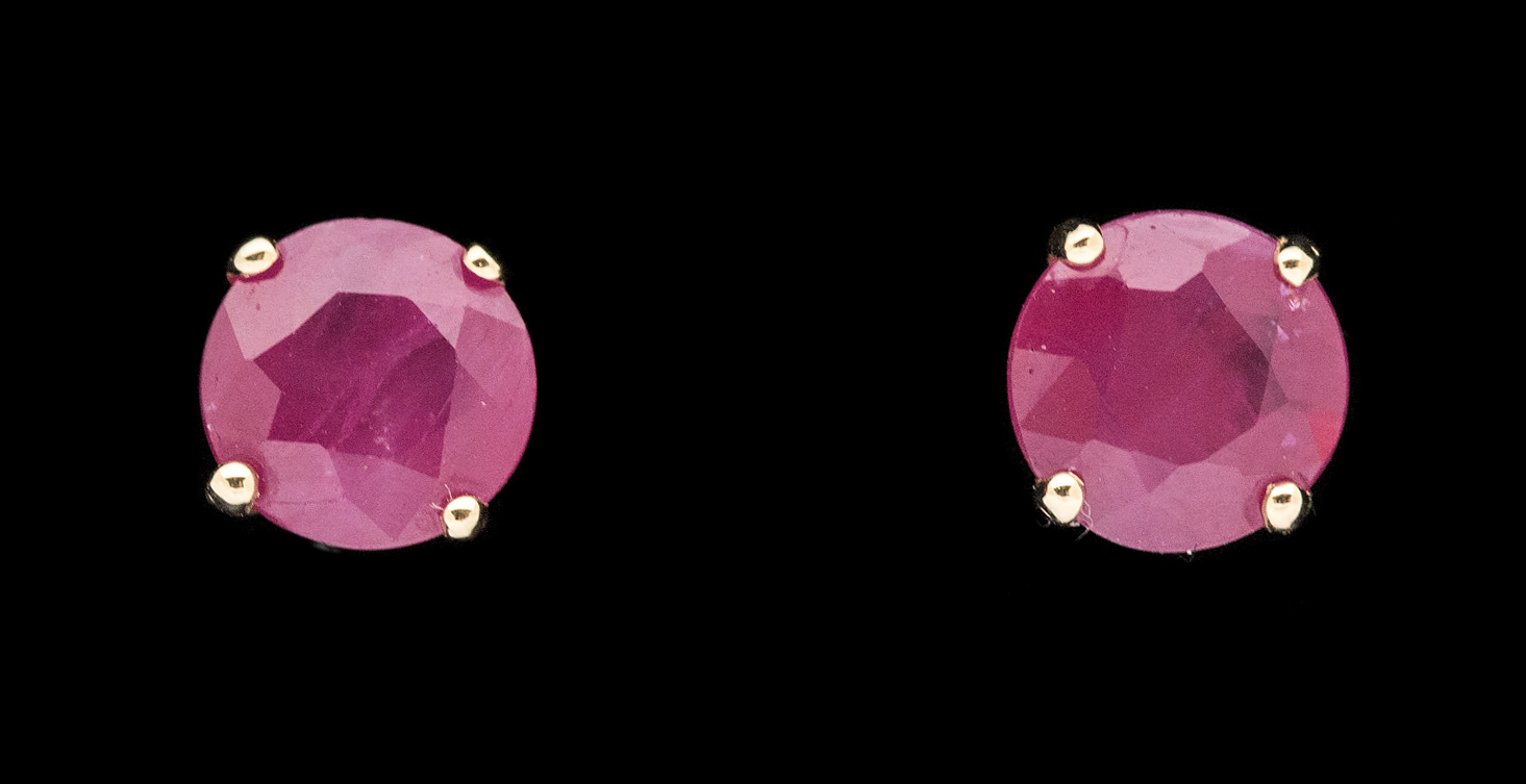 A pair of ruby and 18ct yellow gold stud earrings, claw set with with a round mixed cut rubies, - Image 2 of 3