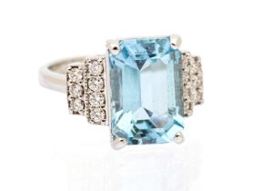 An Art Deco style aquamarine and diamond set 18ct white gold ring, comprising a rectangular step cut