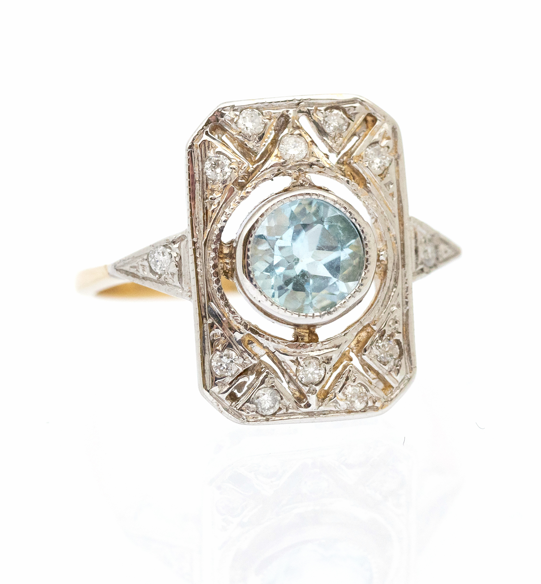 An Art Deco style blue topaz and diamond set 9ct gold panel ring, set with a round mixed blue topaz,