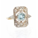 An Art Deco style blue topaz and diamond set 9ct gold panel ring, set with a round mixed blue topaz,