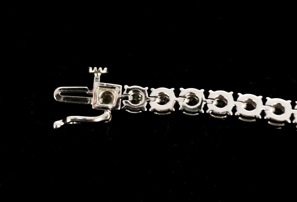 A diamond set 9ct white gold tennis bracelet, comprising forty round brilliant cut diamonds, total - Image 6 of 9