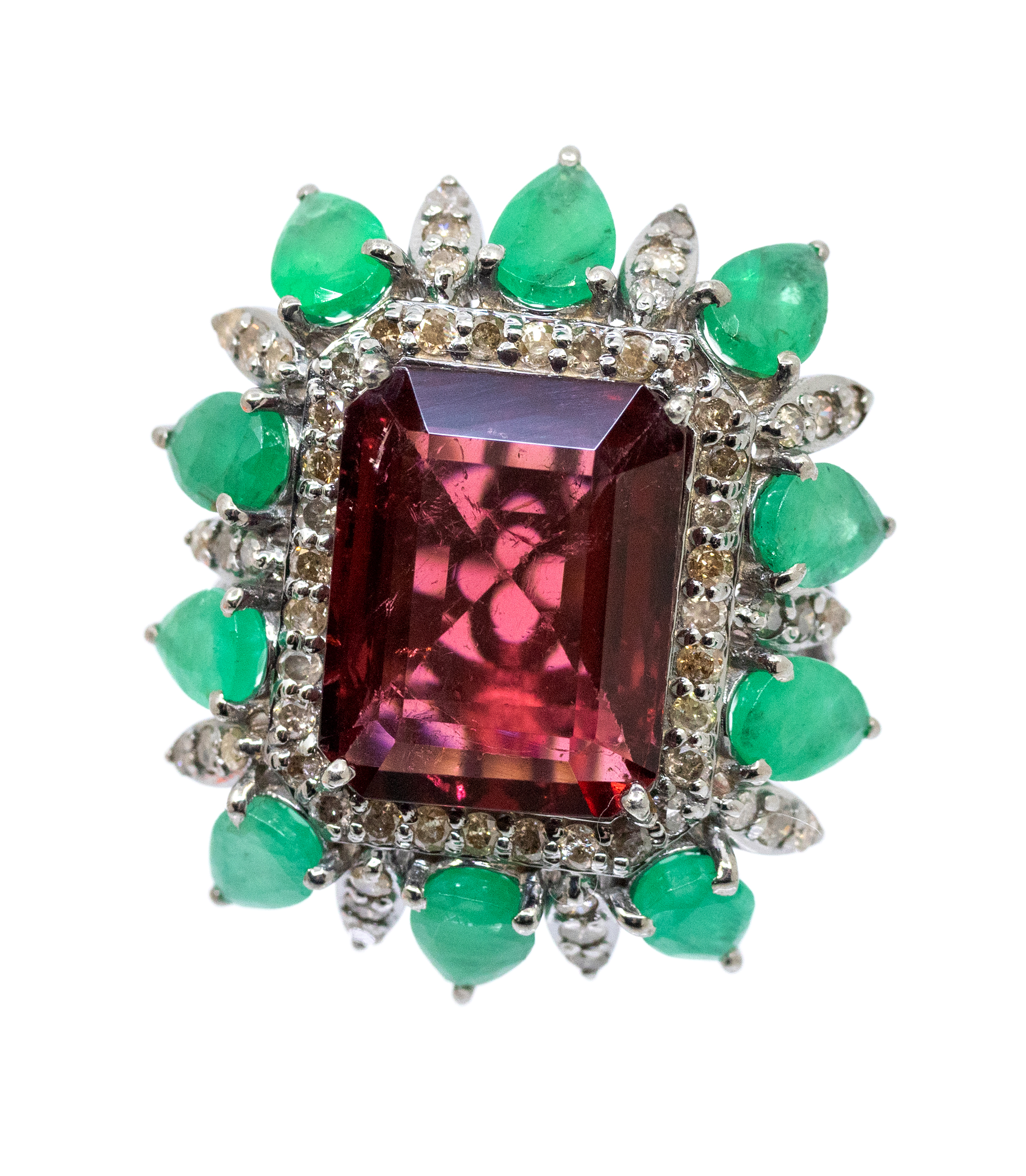 A large tourmaline, emerald and diamond set silver dress ring, comprising a rectangular step-cut