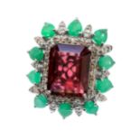 A large tourmaline, emerald and diamond set silver dress ring, comprising a rectangular step-cut