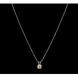 A fancy light brown diamond and 18ct white gold solitaire pendant, comprising a round brilliant