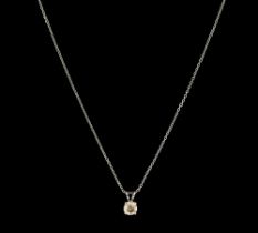 A fancy light brown diamond and 18ct white gold solitaire pendant, comprising a round brilliant