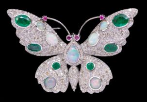 An Art Nouveau style opal, diamond, emerald and ruby silver pendant/brooch and pendant in silver,
