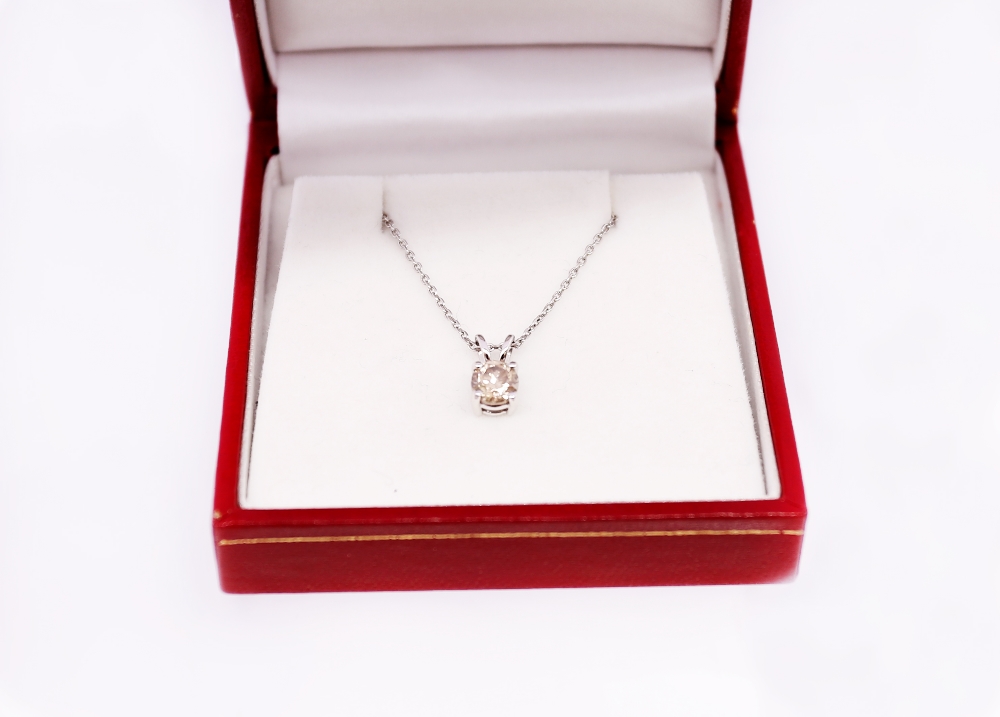 A fancy light brown diamond and 18ct white gold solitaire pendant, comprising a round brilliant - Image 4 of 4