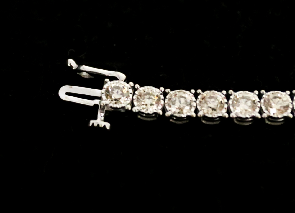 A diamond set 9ct white gold tennis bracelet, comprising forty round brilliant cut diamonds, total - Image 2 of 9