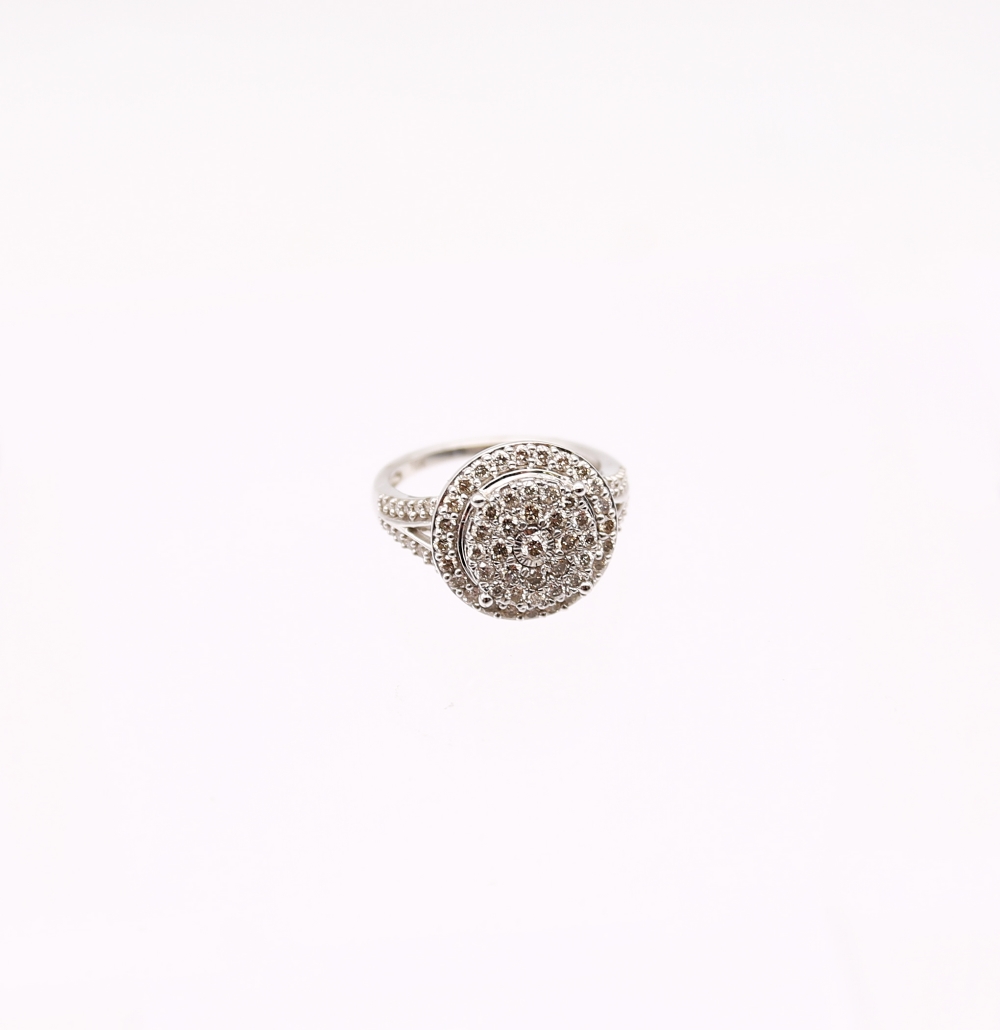 A diamond set 9ct white gold halo cluster ring, set with round brilliant cut diamonds, total diamond