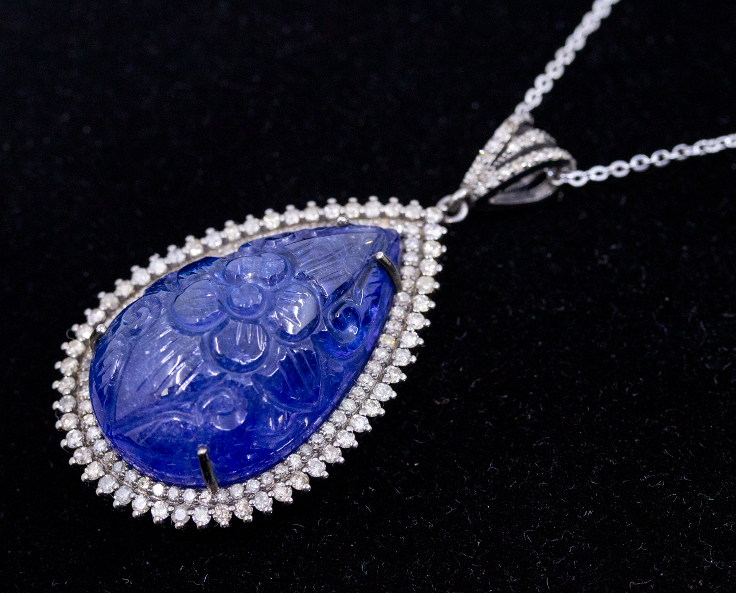 A large tanzanite and diamond set silver pendant, comprising a carved pear shaped tanzanite, total - Image 2 of 4