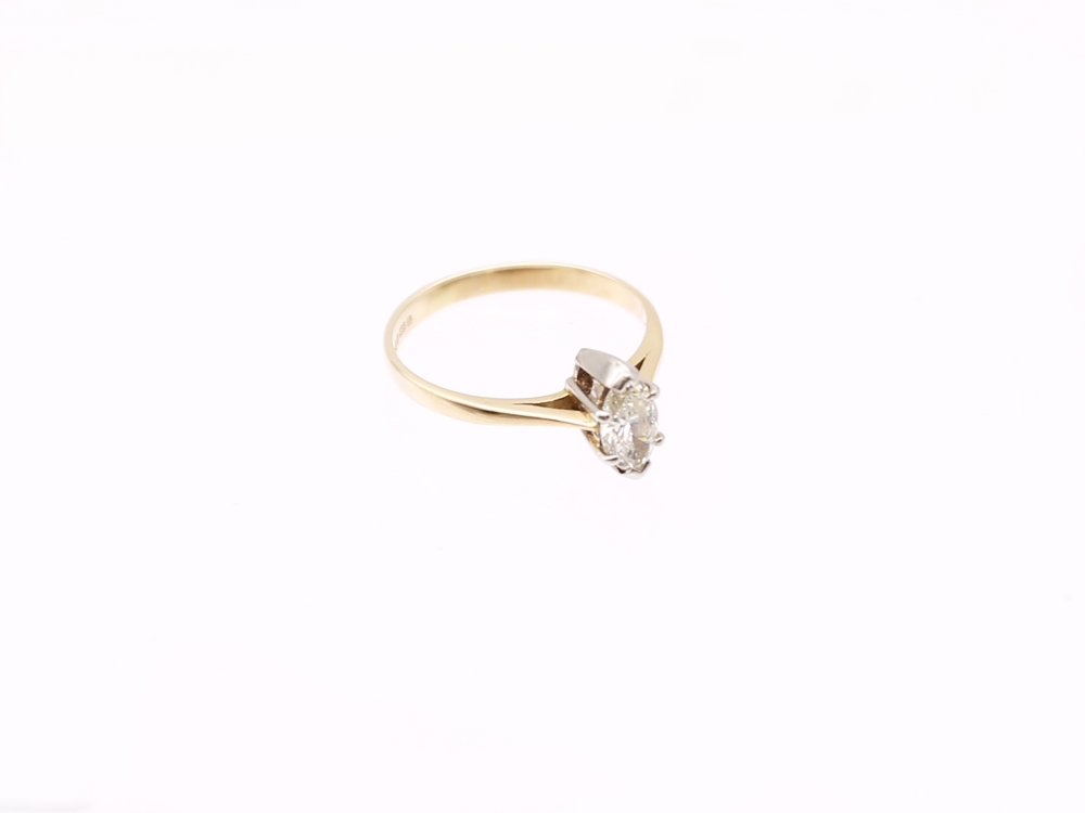 A marquise-cut diamond and 14ct gold solitaire ring, comprising a diamond weighing approx 0.60ct,