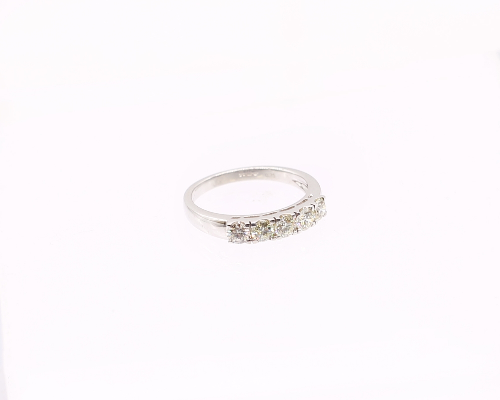 A diamond set 18ct white gold ring, comprising five round brilliant cut diamonds, claw set, total