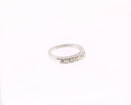 A diamond set 18ct white gold ring, comprising five round brilliant cut diamonds, claw set, total
