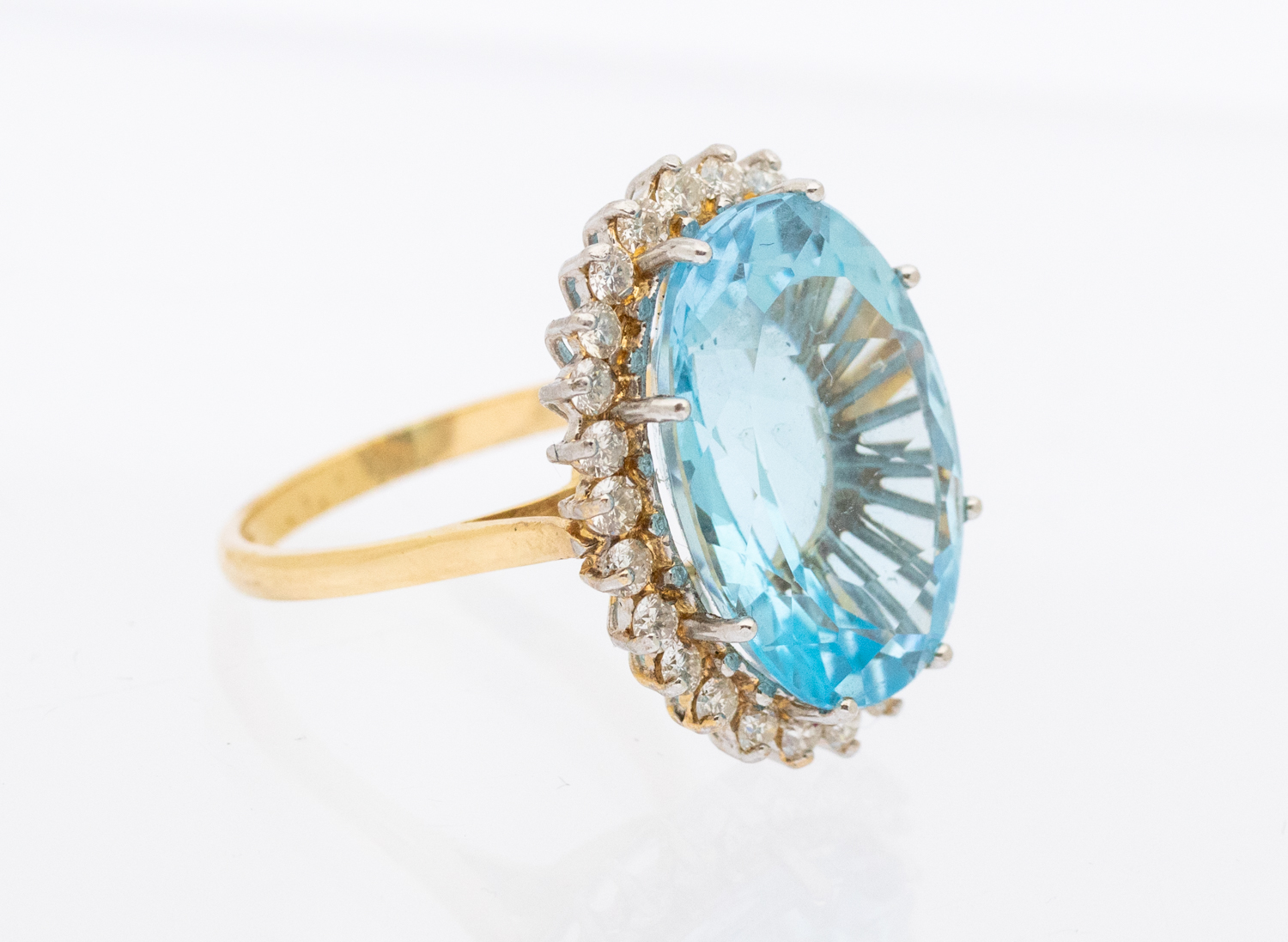 A blue topaz and diamond set 18ct gold cocktail ring, comprising an oval mixed cut blue topaz (Swiss - Image 2 of 3