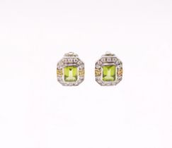 A pair of Peridot and diamond 18ct white gold earrings, comprising an octagonal design rub over