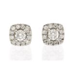 A pair of diamond and 14ct white gold cluster earrings, comprising cushion shaped mount claw set