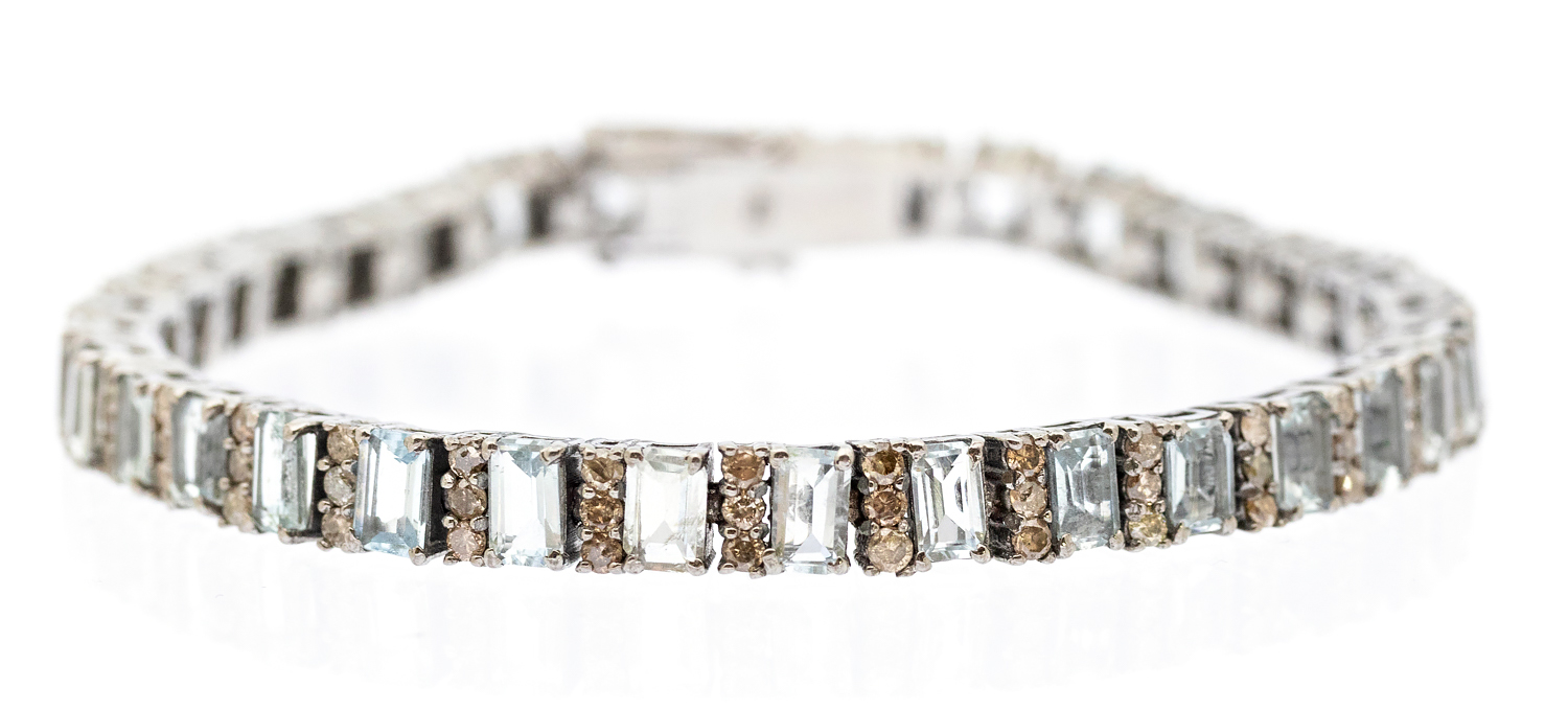 An Art Deco-style aquamarine and diamond set silver bracelet, set with alternate rectangular cut