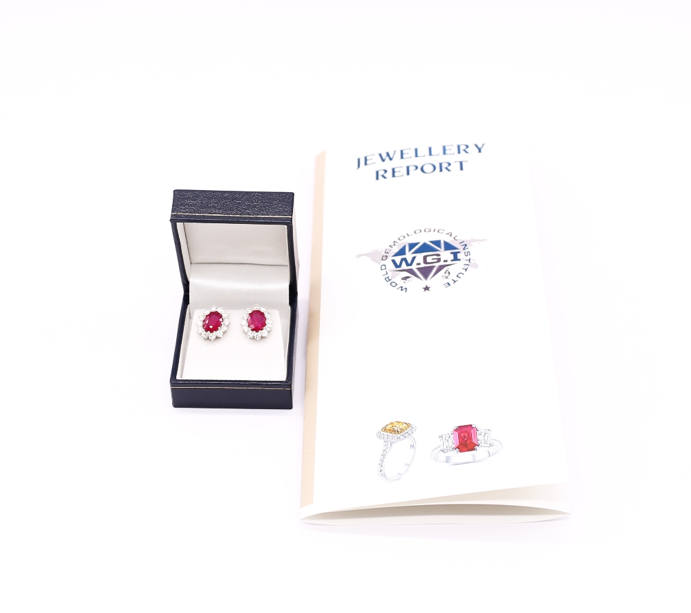 A pair of ruby and diamond set 18ct white gold oval cluster studs, rubies weighing a total of approx - Image 4 of 5