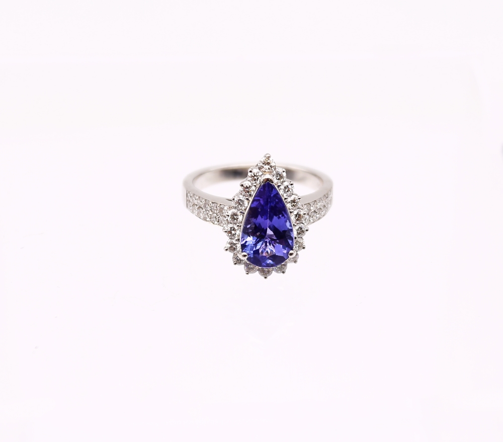 A tanzanite and diamond 8ct white gold ring, comprising a mixed pear-cut tanzanite, weighing