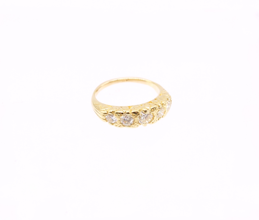 A vintage style diamond and 18ct yellow gold ring, comprising a row of five graduated round