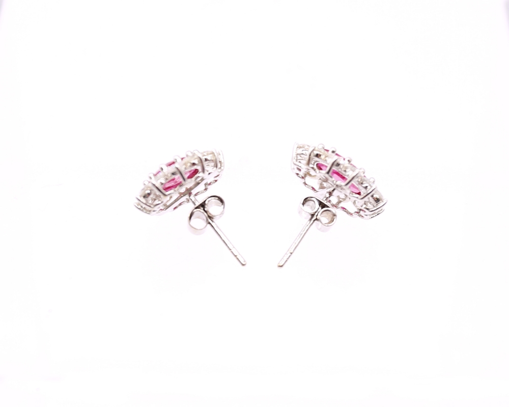 A pair of ruby and diamond set 18ct white gold oval cluster studs, rubies weighing a total of approx - Image 3 of 5