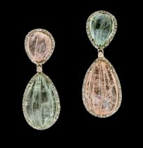A pair of large aquamarine and morganite white metal drop earrings, comprising carved pear shaped