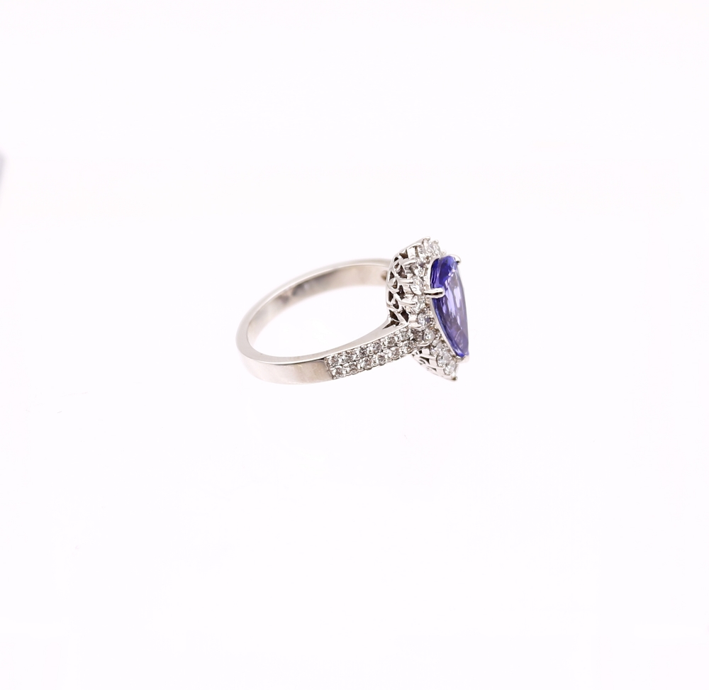 A tanzanite and diamond 8ct white gold ring, comprising a mixed pear-cut tanzanite, weighing - Image 2 of 6