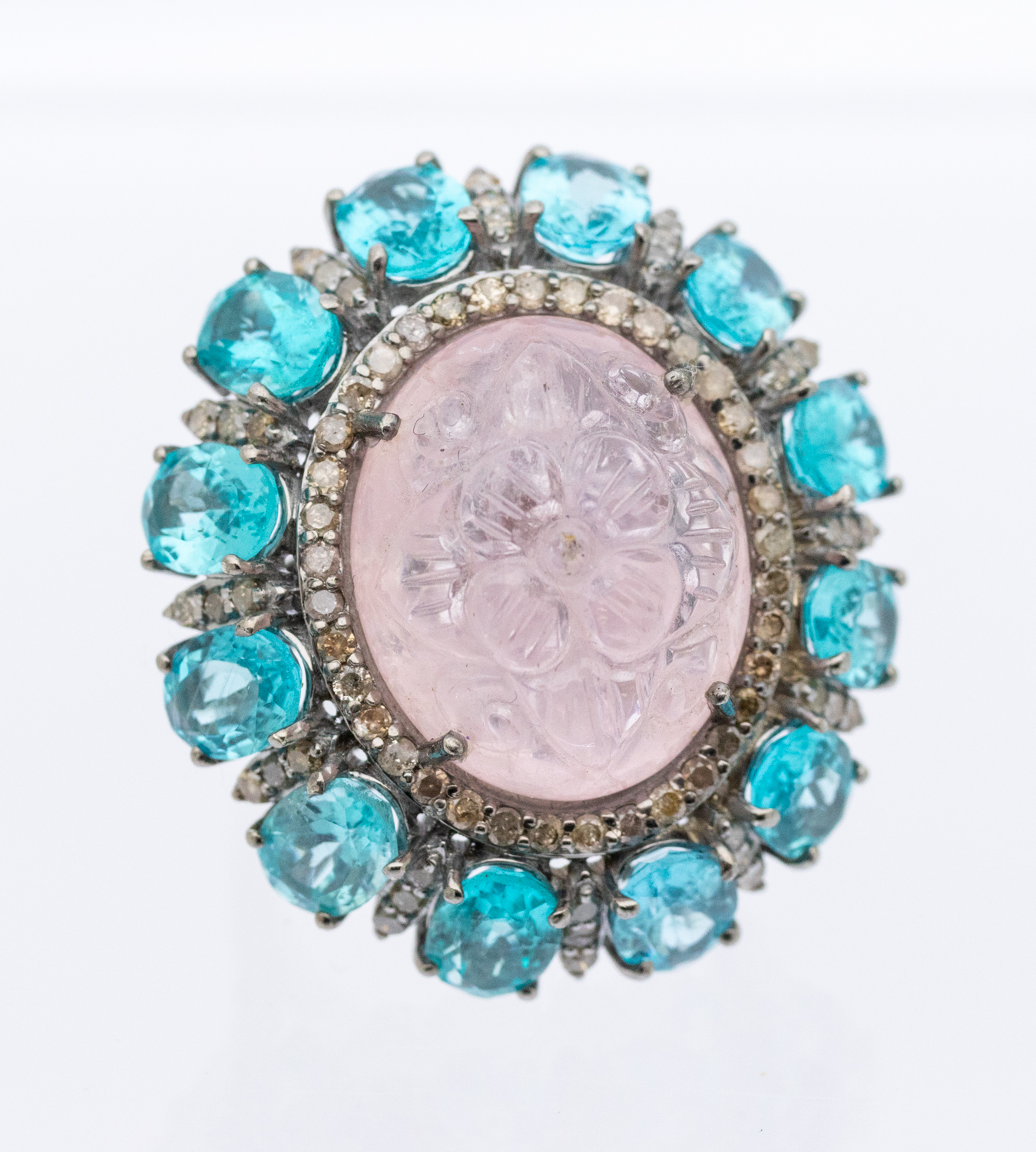 A large morganite and apatite diamond set silver dress ring, comprising an oval cabochon morganite