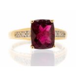 A tourmaline and diamond set 14ct yellow gold dress ring, claw set with a rectangular cushion cut