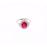 A ruby and diamond 18ct white Art Deco style cluster ring, the central ruby weighing approx 2.