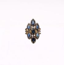 A large sapphire and diamond set silver gilt ring, set with marquise cut sapphires within diamond