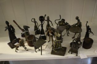 A collection of Nigerian Fon tribal art bronze and brass figures and figure groups to include