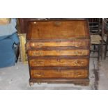 Georgian oak and inlaid drop front bureau with brass handles. 91cm wide. (1)