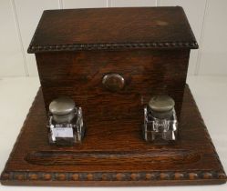 A late Victorian oak desk top combination inkstand and stationery box, 28cm wide
