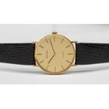 Men's 9ct Gold Bulova Quartz Watch with Black leather strap.  The watch has a Gold coloured dial