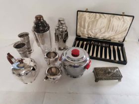 A group of plated ware to include 2 cocktail shakers, a pair of vases, a tea set, and fish set,