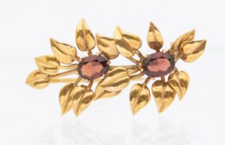 9ct Yellow Gold Garnet Flower/Leaf Brooch.  The Brooch contains two Oval Brilliant Cut Garnets