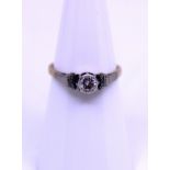 Unmarked Yellow and White Metal approx. 0.20ct Solitaire Round Brilliant Cut Diamond Ring. The 0.