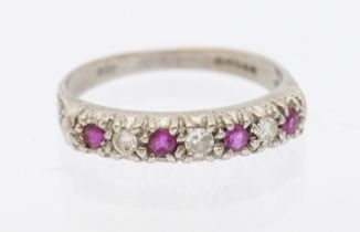 18ct White Gold Seven Stone Ruby & Diamond Half Eternity Ring.  The ring has three approx 0.02ct