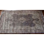 A silk hand-knotted rug purchased in the Far East, slight wear/repairs to edges, approximately 123cm