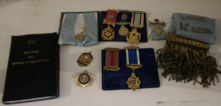 Four silver gilt Masonic medals, four others a "Ye Exe Valley Lodge" sash, a Masonic rule book and