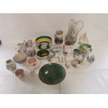 A collection of Poole pottery items to include two earlier pieces stamped Carter Stabler Adams