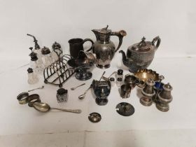 A quantity of silver plated items to include; an antler handled jug, an engraved teapot, cruet